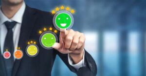 Calidad en las grandes empresas. Aparecen cinco caritas con estrellas encima. La primera roja con una estrella y va aumentando hasta llegar a la carita verde con cinco estrellas.